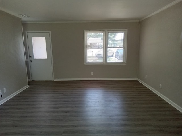 unfurnished room with dark hardwood / wood-style floors and ornamental molding