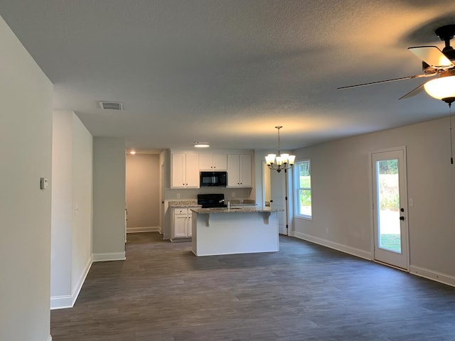 461 Riley Cir, Milledgeville, GA 31061 - kitchen featuring black microwave, a ceiling fan, range, a chandelier, and white cabinetry