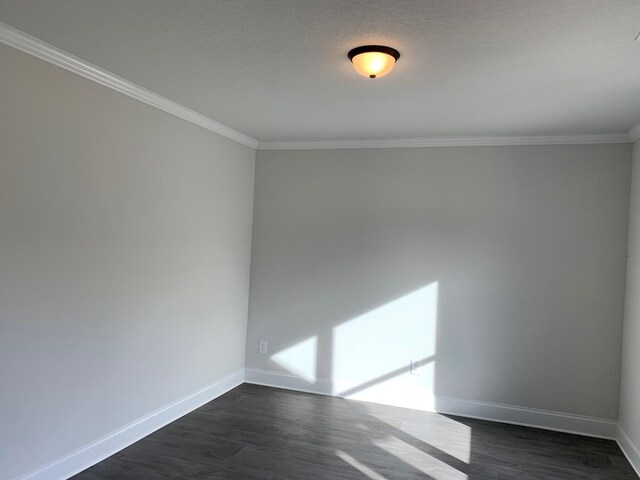 461 Riley Cir, Milledgeville, GA 31061 - empty room with crown molding and dark wood-style floors