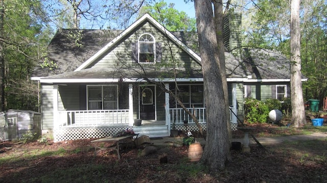 131 NE Carriage Ct, Milledgeville, GA 31061 - view of front of property featuring a chimney and covered porch
