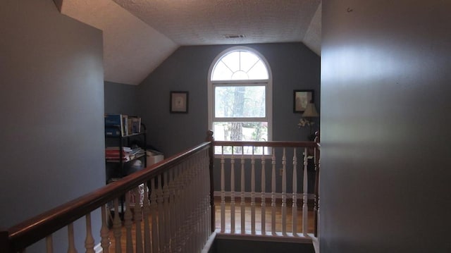 131 NE Carriage Ct, Milledgeville, GA 31061 - interior space with visible vents, vaulted ceiling, and a textured ceiling