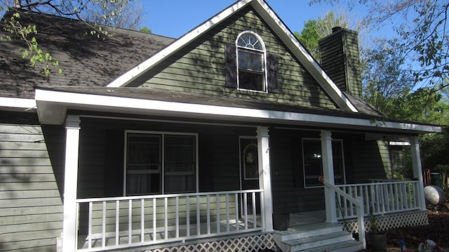 131 NE Carriage Ct, Milledgeville, GA 31061 - view of front of property featuring a porch and a chimney