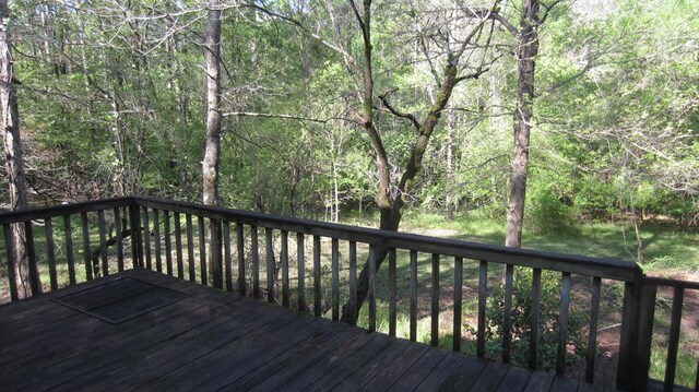 131 NE Carriage Ct, Milledgeville, GA 31061 - wooden terrace featuring a forest view