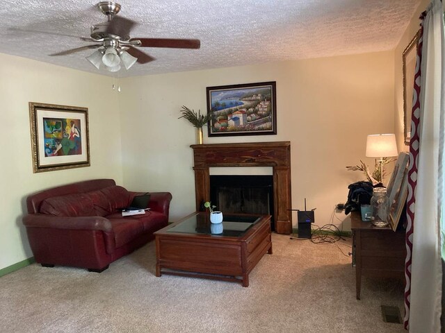 131 NE Carriage Ct, Milledgeville, GA 31061 - living room featuring a textured ceiling, a ceiling fan, and carpet floors