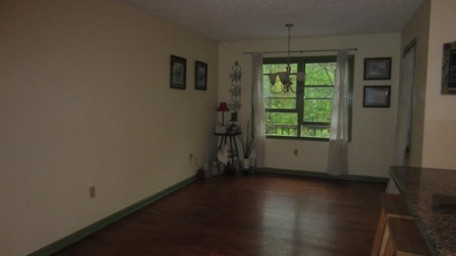 131 NE Carriage Ct, Milledgeville, GA 31061 - dining area with baseboards and wood finished floors