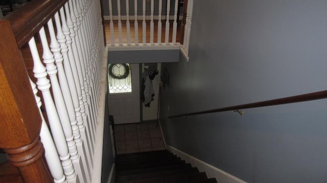 131 NE Carriage Ct, Milledgeville, GA 31061 - staircase featuring baseboards