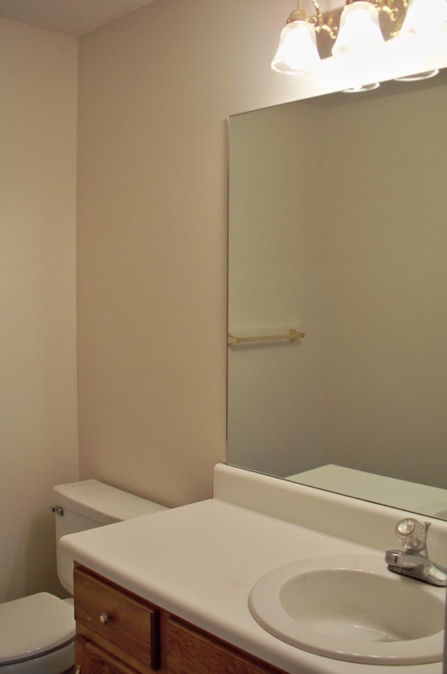121 Long Island Dr, Eatonton, GA 31024 - bathroom with vanity and a chandelier
