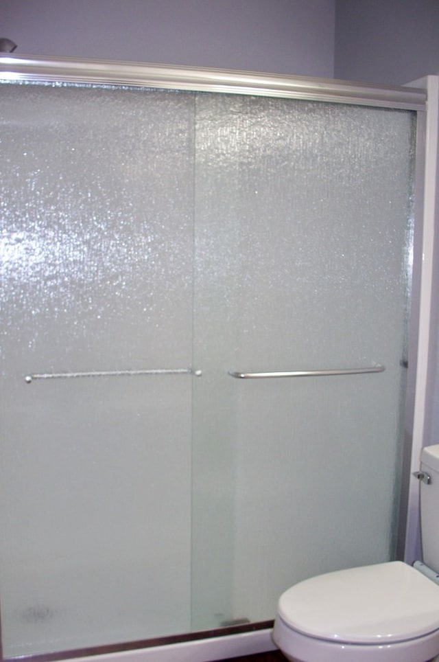 121 Long Island Dr, Eatonton, GA 31024 - bathroom featuring a shower stall and toilet