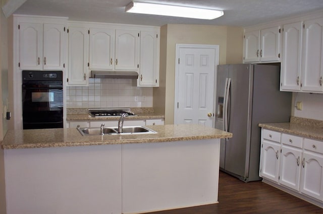 121 Long Island Dr, Eatonton, GA 31024 - kitchen featuring stainless steel appliances, white cabinets, tasteful backsplash, and dark wood-type flooring
