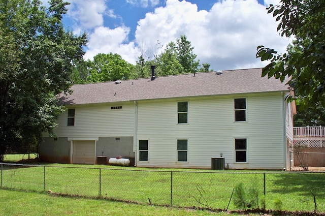 121 Long Island Dr, Eatonton, GA 31024 - rear view of property featuring an attached garage and roof with shingles