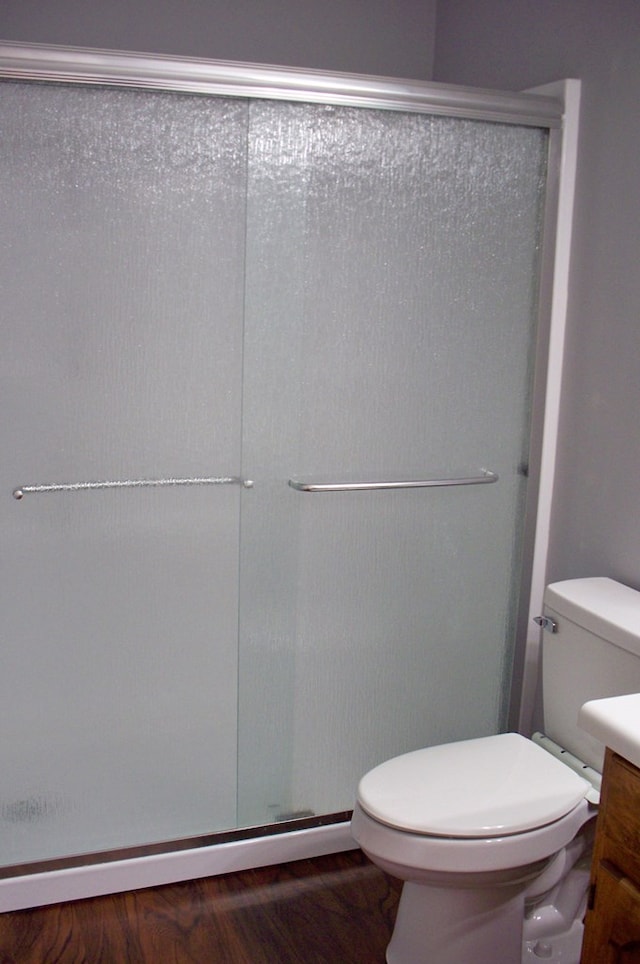 121 Long Island Dr, Eatonton, GA 31024 - bathroom with a shower stall, wood finished floors, and vanity