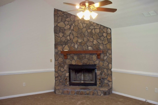 121 Long Island Dr, Eatonton, GA 31024 - unfurnished living room featuring carpet flooring, a ceiling fan, a stone fireplace, and vaulted ceiling