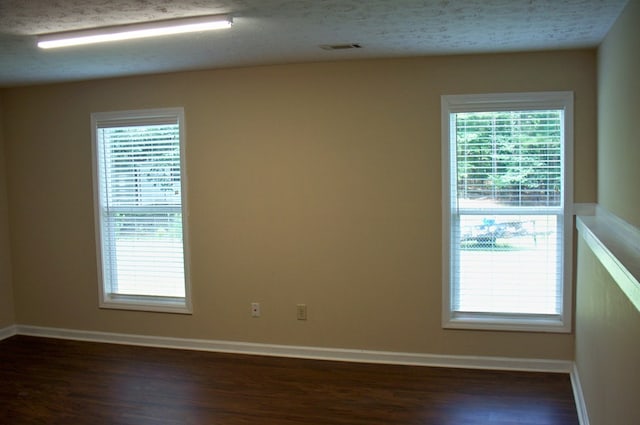 121 Long Island Dr, Eatonton, GA 31024 - unfurnished room with dark wood-style flooring