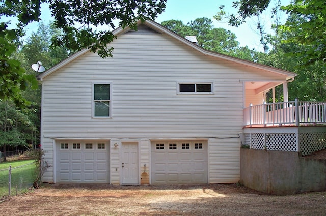 121 Long Island Dr, Eatonton, GA 31024 - view of property exterior featuring a wooden deck and dirt driveway