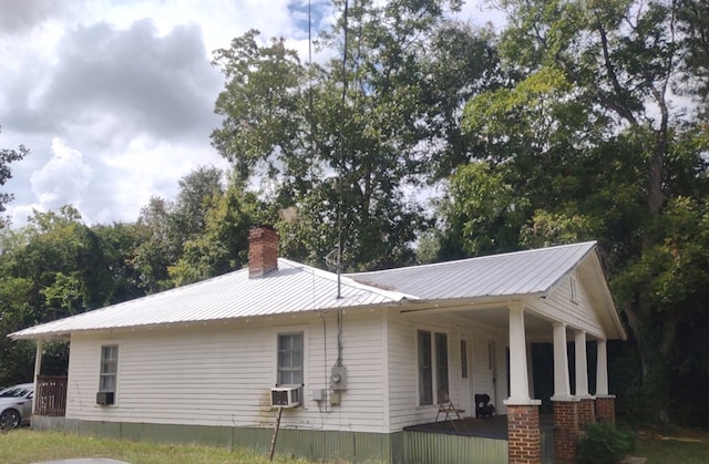 view of side of home featuring a porch