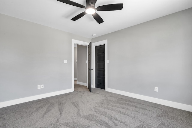 carpeted empty room with ceiling fan