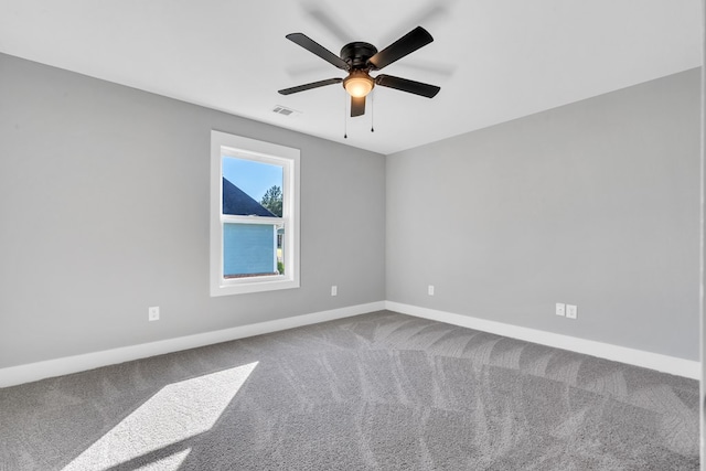 empty room with carpet flooring and ceiling fan