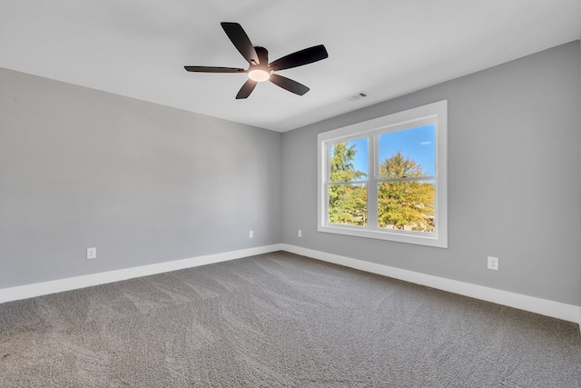 unfurnished room featuring carpet and ceiling fan