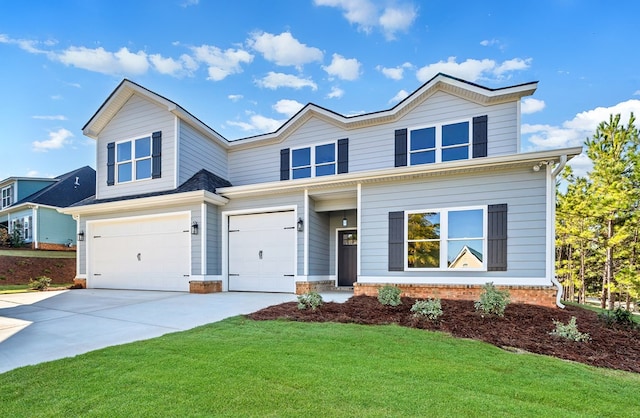 view of front of house with a garage and a front lawn