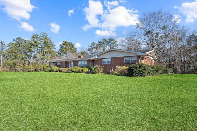 ranch-style home with a front lawn