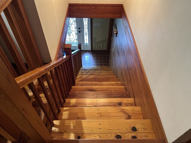 staircase with wood finished floors