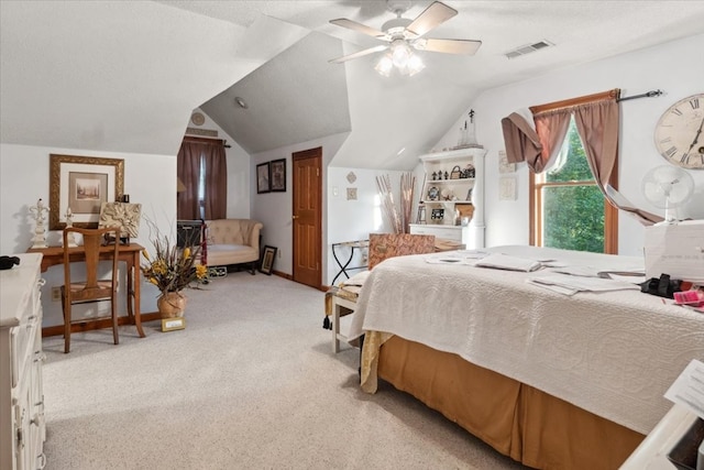 bedroom featuring vaulted ceiling, carpet flooring, baseboards, visible vents, and a ceiling fan