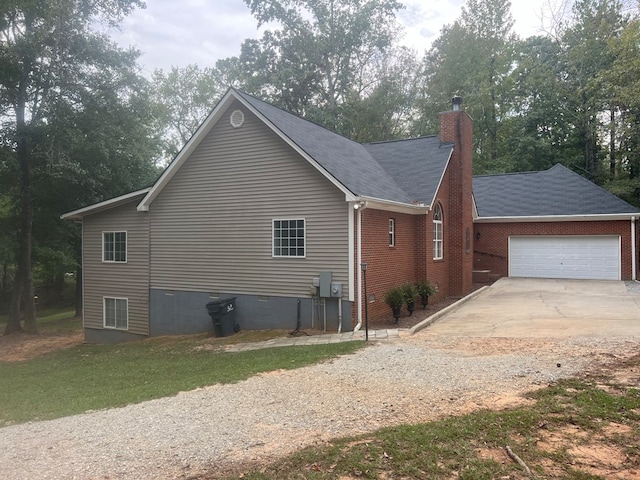 view of side of home with a garage