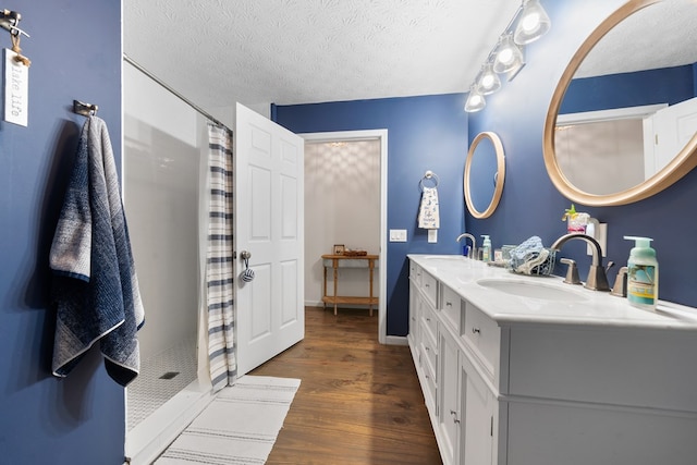 111 Southlake Dr, Eatonton, GA 31024 - full bath featuring a shower with curtain, wood finished floors, a sink, and double vanity