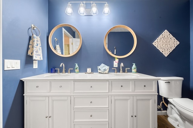 111 Southlake Dr, Eatonton, GA 31024 - full bath with baseboards, a sink, double vanity, and toilet