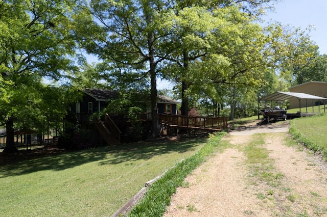 111 Southlake Dr, Eatonton, GA 31024 - view of yard featuring a carport, driveway, and a deck