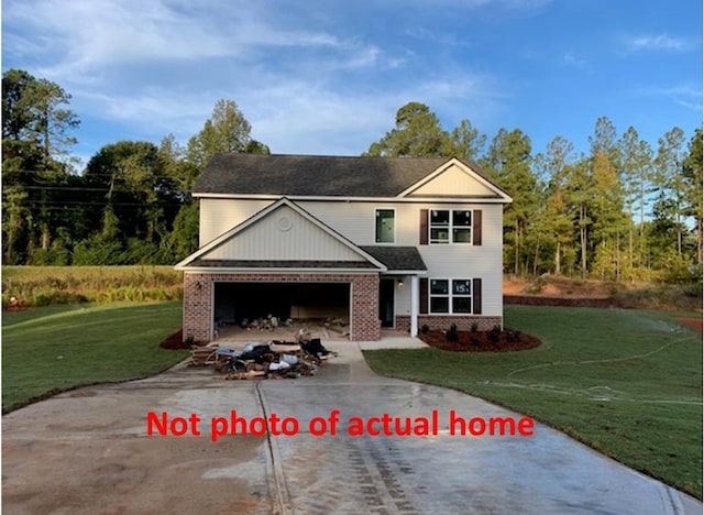 view of front property with a garage and a front yard