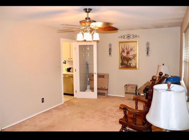 living area featuring ceiling fan, french doors, and carpet floors