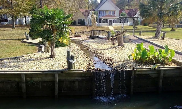 view of community featuring a lawn