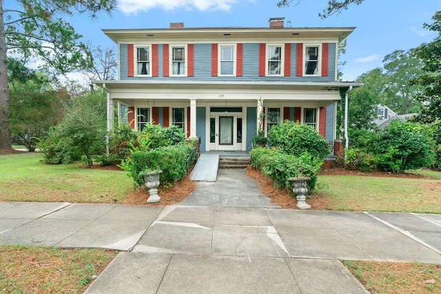 view of front of home with a front lawn