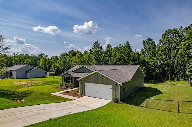 ranch-style house featuring a front yard and a garage