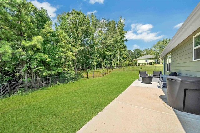 view of yard with an outdoor living space and a patio