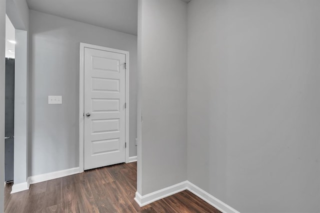 unfurnished room featuring dark hardwood / wood-style flooring