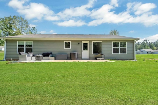 back of house featuring an outdoor living space, a patio, and a yard