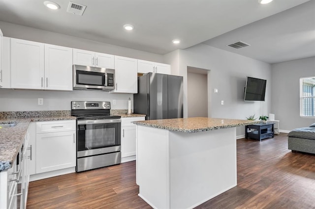 kitchen featuring a center island, white cabinetry, and appliances with stainless steel finishes