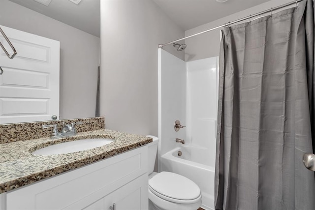 full bathroom featuring shower / tub combo with curtain, vanity, and toilet