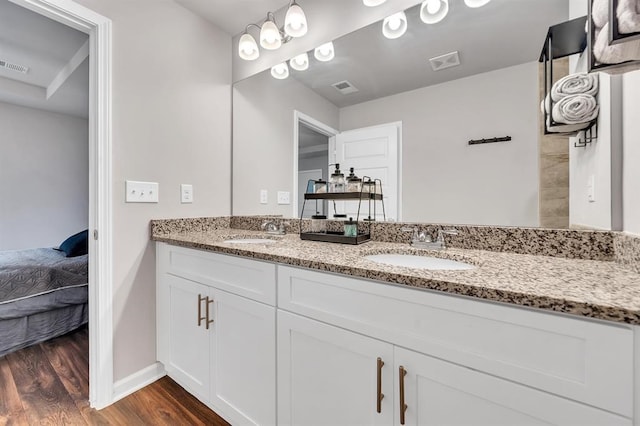 bathroom featuring hardwood / wood-style floors and vanity