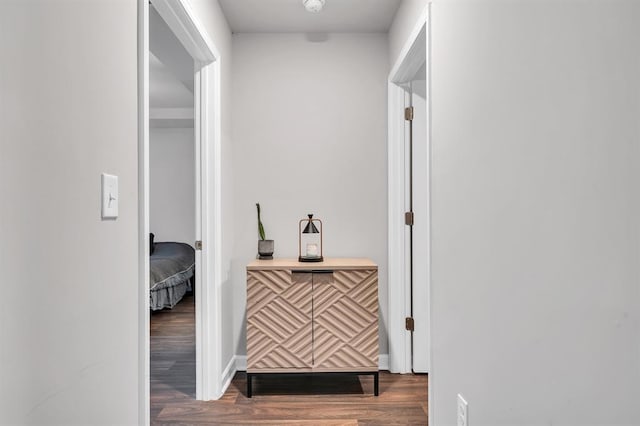 corridor featuring wood-type flooring