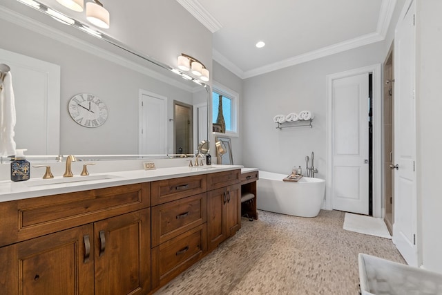 202 Jackson Rd, Milledgeville, GA 31061 - bathroom featuring double vanity, a freestanding tub, crown molding, and recessed lighting