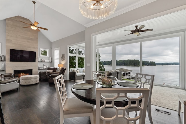 202 Jackson Rd, Milledgeville, GA 31061 - dining area featuring a ceiling fan, high vaulted ceiling, wood finished floors, a tiled fireplace, and a water view