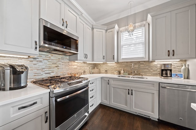 202 Jackson Rd, Milledgeville, GA 31061 - kitchen with appliances with stainless steel finishes, ornamental molding, light countertops, decorative backsplash, and white cabinets