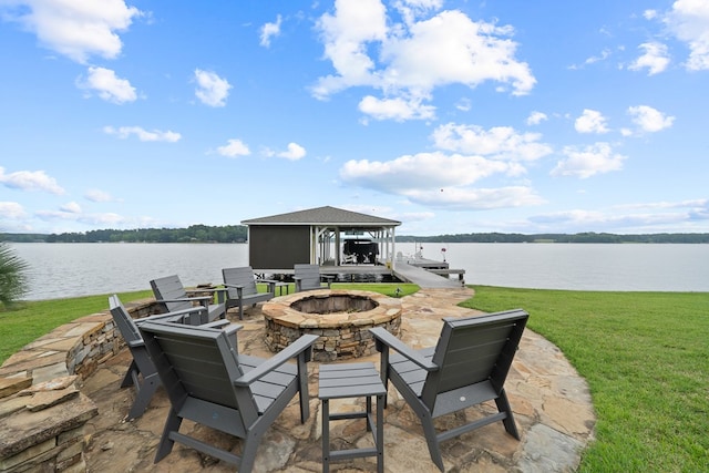 202 Jackson Rd, Milledgeville, GA 31061 - view of patio featuring an outdoor fire pit, a water view, a boat dock, and boat lift