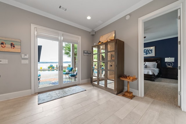 202 Jackson Rd, Milledgeville, GA 31061 - entryway featuring crown molding, french doors, light wood-style flooring, and recessed lighting