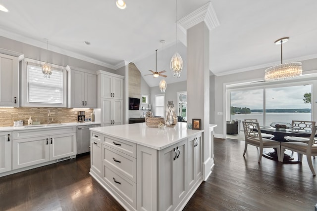 202 Jackson Rd, Milledgeville, GA 31061 - kitchen with a chandelier, stainless steel dishwasher, light countertops, tasteful backsplash, and lofted ceiling