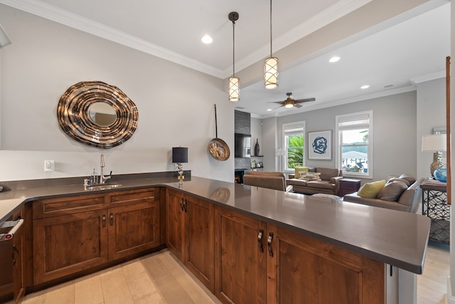 202 Jackson Rd, Milledgeville, GA 31061 - kitchen with dark countertops, recessed lighting, a peninsula, crown molding, and decorative light fixtures