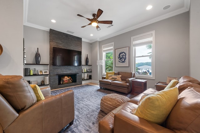 202 Jackson Rd, Milledgeville, GA 31061 - living room with ceiling fan, a stone fireplace, recessed lighting, ornamental molding, and wood finished floors